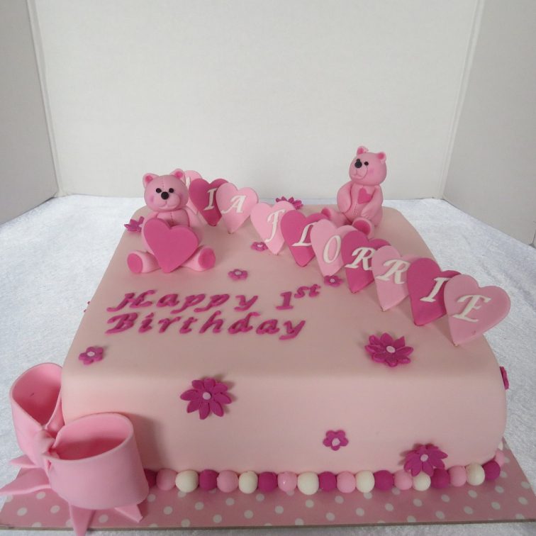 Pink cake with bears and hearts